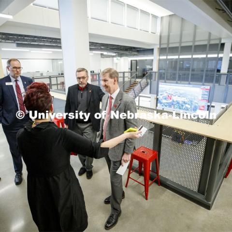 Megan Elliott, founding director of the Johnny Carson Center for Emerging Media Arts, describes the new center to a tour with UNL Chancellor Ronnie Green, center, and NU President Ted Carter, right. To the left of Megan is UNL's Mike Zeleny and NU's Brad Stauffer. NU President Ted Carter tours UNL campuses. January 17, 2020. Photo by Craig Chandler / University Communication.