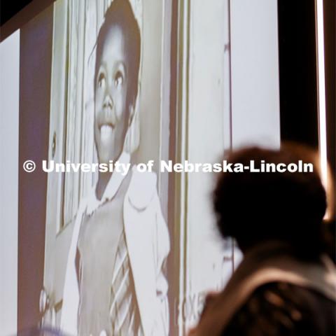 Ruby Bridges looks up at a photo of her as a first grader being integrated into New Orleans public schools. MLK Brunch featuring Ruby Bridges. This year’s program featured a special keynote address by American civil rights activist Ruby Bridges and the awarding of the annual Chancellor’s “Fulfilling the Dream” Award to Nebraska Law professor and interim dean Anna Shavers. January 22, 2020. Photo by Craig Chandler / University Communication.