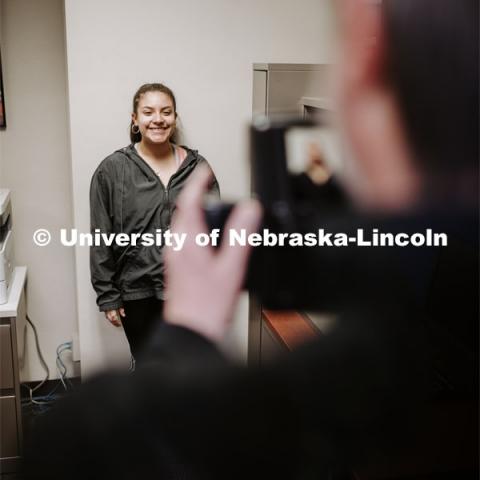 Olivia Cano has her photo taken by Scott Hurst. She was a winner in the Husker Passport Giveaway sponsored by Education Abroad. January 30, 2020. Photo by Craig Chandler / University Communication.