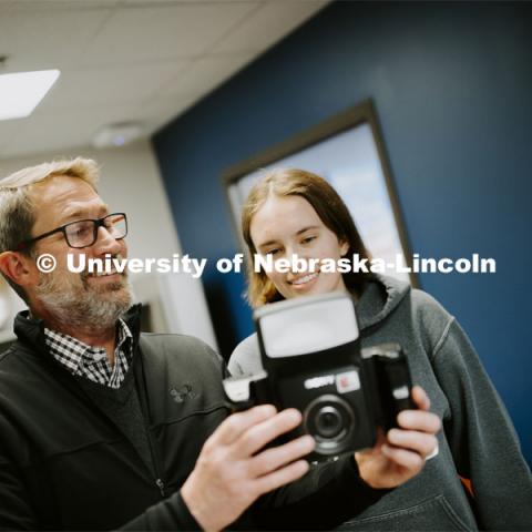 Grace Gawecki approves her photo taken by Scott Hurst at Passport Services. She was a winner in the Husker Passport Giveaway sponsored by Education Abroad. January 30, 2020. Photo by Craig Chandler / University Communication.