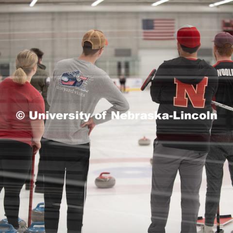 Left to right Anna Fiala, Jordan Monk, Adam Schlichtmann and Colin Wooldrik of the UNL Curling Team watch in anticipation as their competitors stone travels down the ice. Nebraska's nationally-ranked curling club host its first bonspiel at the John Breslow Ice Hockey Center this weekend. The bonspiel — or tournament — featured seven traveling schools from across the Midwest. February 1, 2020. Photo by Gregory Nathan / University Communication.