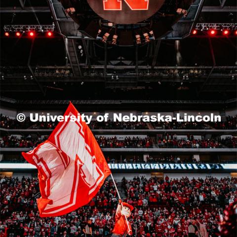 Herbie Husker waves a large N flag at center court to rally the fans. Nebraska vs. Michigan State University men’s basketball game. February 20, 2020.  Photo by Justin Mohling / University Communication.