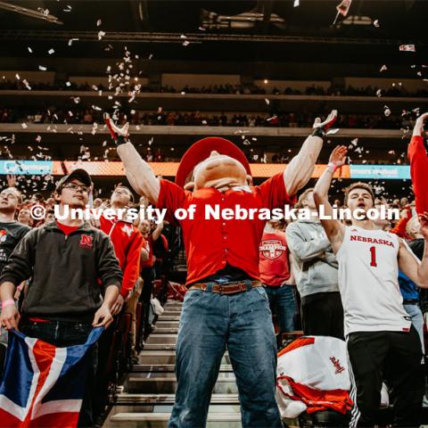 The first point is scored, and Herbie and the student section throws torn up Daily Nebraskan newspapers. Nebraska vs. Michigan State University men’s basketball game. February 20, 2020.  Photo by Justin Mohling / University Communication.