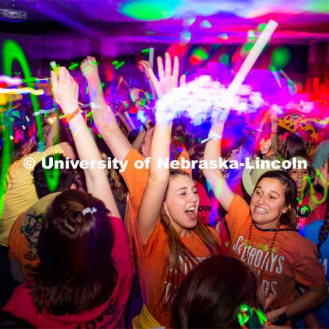 Students dancing in a "Rave"-like setting with glow lights and beach balls bouncing through the crowd. University of Nebraska–Lincoln students exceeded their goal, raising $235,229 during the annual HuskerThon on Feb. 29. Also known as Dance Marathon, the event is part of a nationwide fundraiser supporting Children’s Miracle Network Hospitals. The annual event, which launched in 2006, is the largest student philanthropic event on campus. The mission of the event encourages participants to, “dance for those who can’t.” All funds collected by the Huskers benefit the Children’s Hospital and Medical Center in Omaha. February 29, 2020. Photo by Justin Mohling / University Communication.