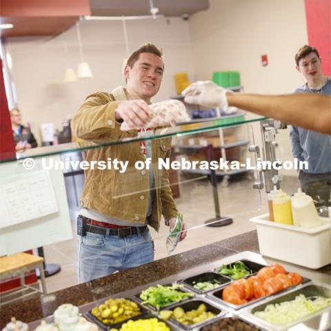 Abel Sandoz Dining Center photo shoot. Student's pick up their order at Husker Heroes. March 3, 2020. Photo by Craig Chandler / University Communication.