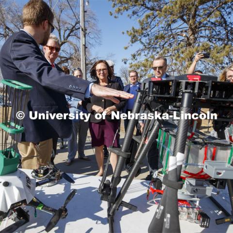 Carrick Detweiler shows Senator Deb Fischer, center, the progression of drones designed to start controlled burns to aid forest fighters and help with conservation. At left is NU President Ted Carter and at right is UNL Chancellor Ronnie Green.  March 6, 2020. Photo by Craig Chandler / University Communication.