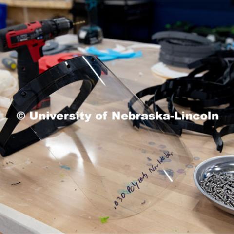 Face shields have been assembled from 3-D printed and laser-cut parts, and now, injection molding will be used to mass-produce parts for face shields. The face shields are being assembled for hospitals in Nebraska in response to COVID-19. April 1, 2020. Photo by Gregory Nathan / University Communication.