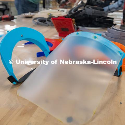Face shields have been assembled from 3-D printed and laser-cut parts, and now, injection molding will be used to mass-produce parts for face shields. The face shields are being assembled for hospitals in Nebraska in response to COVID-19.April 1, 2020. Photo by Gregory Nathan / University Communication.