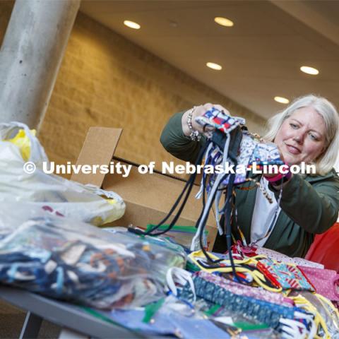 Veronica Riepe, director of student involvement, counts donated masks at University Suites before they're distributed to the nearly 1,000 university employees who continue to work on campus. She is coordinating donations for every housing worker. April 13, 2020 Photo by Craig Chandler / University Communication.