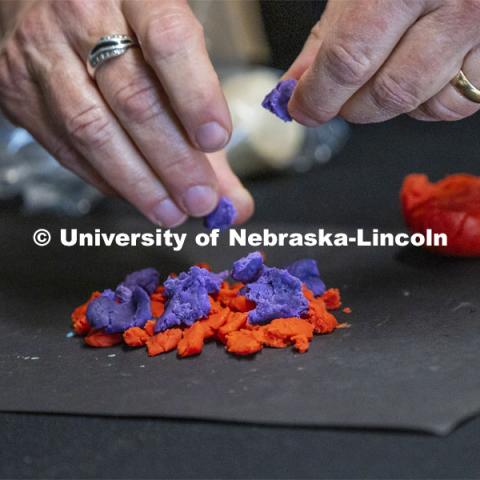 Annie Mumgaard, virtual learning coordinator for the University of Nebraska State Museum, gives a virtual tour to more than 120 young students April 14. She uses pieces of various colors of modeling clay to represent how metamorphic rock is made. April 14, 2020. Photo by Craig Chandler / University Communication.