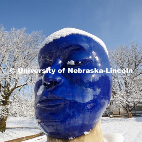 The “Untitled” head by Jun Kaneko in the Sheldon Sculpture Garden, is covered in a layer of snow. An April snowstorm leaves campus unseasonably beautiful. April 17, 2020. Photo by Craig Chandler / University Communication.