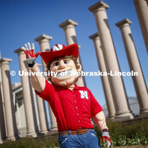 Herbie Husker in front of the columns by Memorial Stadium. On campus. April 30, 2020. Photo by Craig Chandler / University Communication.