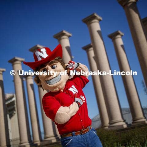 Herbie Husker in front of the columns by Memorial Stadium. On campus. April 30, 2020. Photo by Craig Chandler / University Communication.