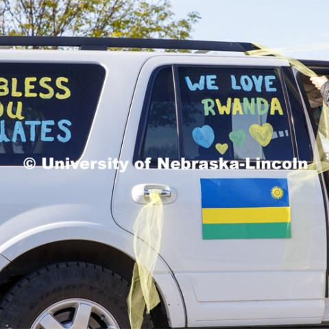 Brenda Menter decorates her vehicle before the parade. Christ Place Church families gave the Rwandan students a vehicle parade to help celebrate the graduates and undergraduates. The church has been host families for about 25 of the 50 Rwandan students who are graduating. They also provided fall and spring event off-campus marking the beginning and ending of each school year along with rides from campus to church and back each Sunday. The group of host families had been planning a graduation party for the students until COVID-19 occurred. Because of COVID-19, the group has planned for a socially distanced “parade” of host family vehicles that circled University Suites on R Street. May 8, 2020. Photo by Craig Chandler / University Communication.