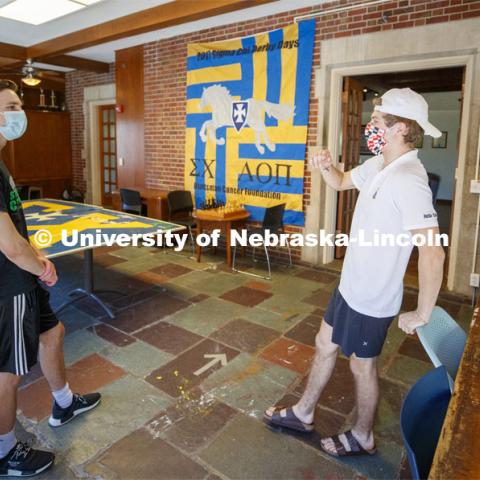 Noah Wilger, sophomore from Lincoln, gives a tour to incoming freshman Joe Vacek. Sigma Chi recruitment day. Sigma Chi members are wearing masks as a result of the COVID-19 pandemic. May 29, 2020. Photo by Craig Chandler / University Communication.