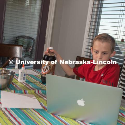 Evan Washburn of Lincoln, participates in the "Virtual Vibes" 4-H Camp. Camp participants receive a box that includes everything they need to complete a fun, hands-on activity. Kits include lesson plans and activity guides for youth ages 8-11 and 11-14. June 2, 2020. Photo by Gregory Nathan / University Communication.