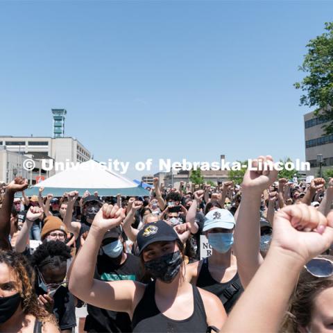 Protestors raise their fists in the air during a moment of silence outside of the Nebraska State Capitol on Saturday, June 13th, 2020, in Lincoln, Nebraska. Black Lives Matter Protest. Photo by Jordan Opp for University Communication.