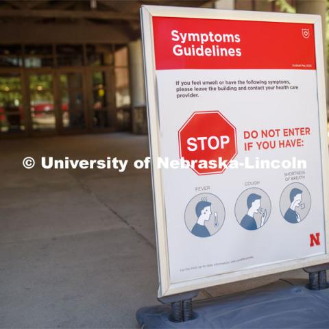 Symptoms guidelines and social distancing signs are strategically placed throughout the Rec Center. First day of Campus Recreation re-opening after being shut down due to COVID-19 concerns. June 15, 2020. Photo by Craig Chandler / University Communication.