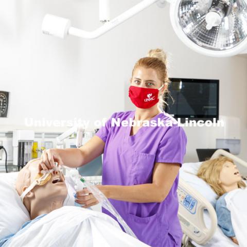 Tia Stevenson, staff member with the University Health Center and College of Nursing, demonstrates intubation in the college’s nursing lab. June 19, 2020. Photo by Craig Chandler / University Communication.