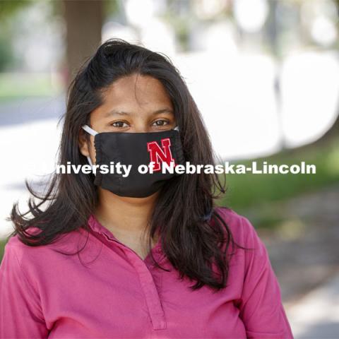 Asmita Jayswal, junior in computer science, models the new N mask. More than 60,000 face masks are to be distributed to all students, faculty and staff for the fall semester. June 26, 2020. Photo by Craig Chandler / University Communication.