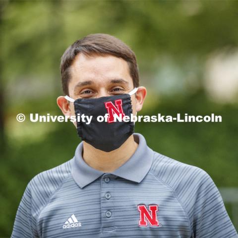 Moi Padilla, Director of the Nebraska College Preparatory Academy, shows off the new N mask. More than 60,000 face masks are to be distributed to all students, faculty and staff for the fall semester. June 26, 2020. Photo by Craig Chandler / University Communication.