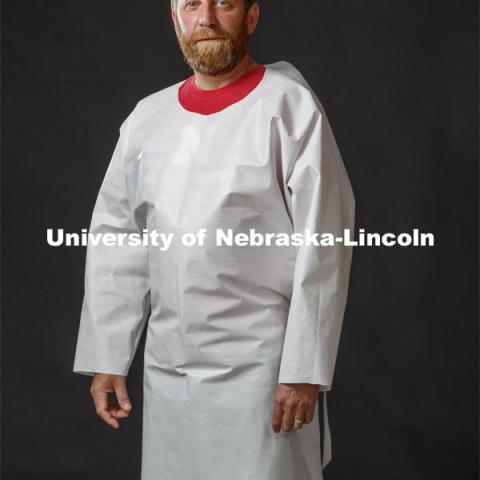 Jerry Reif, shop manager at Nebraska Innovation Studio, wears a PPE gown designed at manufactured at Nebraska Innovation Studios. Photo for the 2019-2020 Report Representing Nebraska’s Research Heroes. June 29, 2020. Photo by Craig Chandler / University Communication.