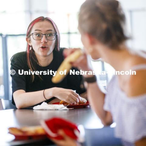 Students eating in the Willa Cather Dining Center. Photo shoot of students wearing masks and practicing social distancing in dining services in Willa Cather Dining Center. July 1, 2020. Photo by Craig Chandler / University Communication.