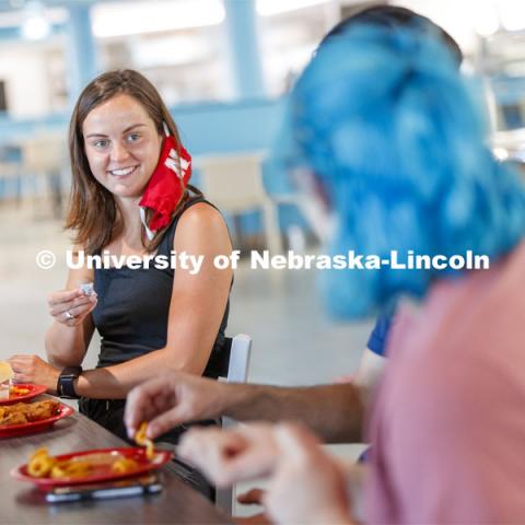 Students eating in the Willa Cather Dining Center. Photo shoot of students wearing masks and practicing social distancing in dining services in Willa Cather Dining Center. July 1, 2020. Photo by Craig Chandler / University Communication.