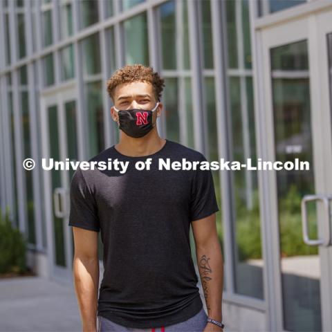Hunter Johnson, a Junior in finance from Omaha wears a Husker mask. Photo shoot of students wearing masks and practicing social distancing in dining services in Willa Cather Dining Center. July 1, 2020. Photo by Craig Chandler / University Communication.