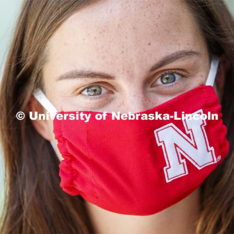 Anna Sambol, a Senior in Nutritional Science and Dietetics wears a Husker mask. Photo shoot of students wearing masks and practicing social distancing in dining services in Willa Cather Dining Center. July 1, 2020. Photo by Craig Chandler / University Communication.
