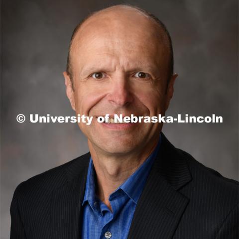 Studio portrait of Daniel Ciobanu, Courtesy Associate Professor, School of Veterinary Medicine and Biomedical Sciences, and School of Biological Sciences, and Associate Professor of Animal Science. July 14, 2020. Photo by Greg Nathan / University Communication.