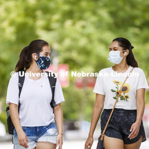 Anamaría Guzmán and Shridula Hegde walk through city campus. August 4, 2020. Photo by Craig Chandler / University Communication.