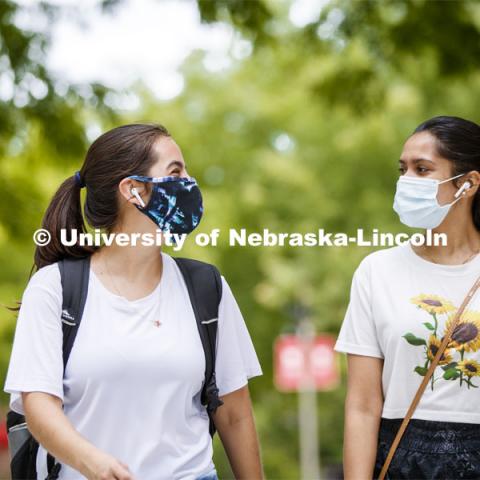 Anamaría Guzmán and Shridula Hegde walk through city campus. August 4, 2020. Photo by Craig Chandler / University Communication.