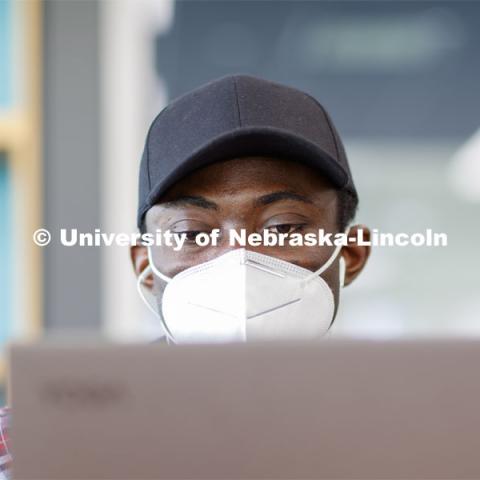 Isaac Kyei, a graduate student in chemistry, studies in Love Library North. August 4, 2020. Photo by Craig Chandler / University Communication.