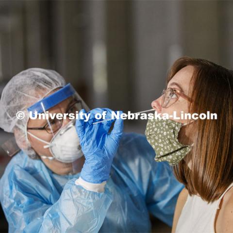 Photo shoot of UNL On-Campus COVID Testing Site. A medical technician completes a nasal swab test at the new COVID-19 testing site. Testing is available at the University Health Center and at a testing site behind the University of Nebraska–Lincoln Police Station, in the 17th and R parking garage. August 6, 2020. Photo by Craig Chandler / University Communication.