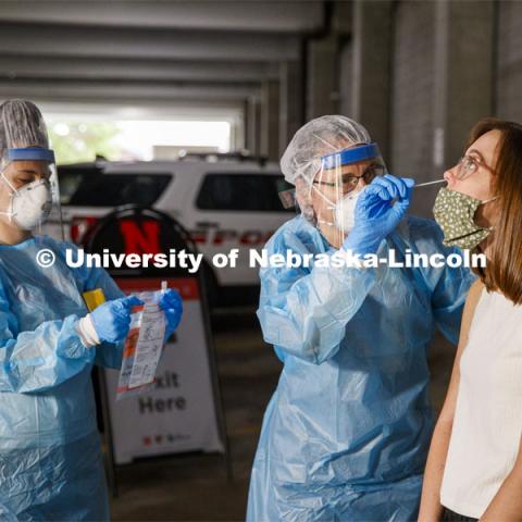Photo shoot of UNL On-Campus COVID Testing Site. A medical technician completes a nasal swab test at the new COVID-19 testing site. Testing is available at the University Health Center and at a testing site behind the University of Nebraska–Lincoln Police Station, in the 17th and R parking garage. August 6, 2020. Photo by Craig Chandler / University Communication.