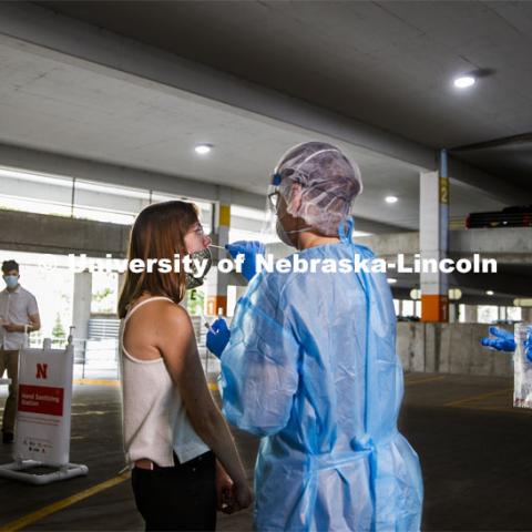 Photo shoot of UNL On-Campus COVID Testing Site. A medical technician completes a nasal swab test at the new COVID-19 testing site. Testing is available at the University Health Center and at a testing site behind the University of Nebraska–Lincoln Police Station, in the 17th and R parking garage. August 6, 2020. Photo by Craig Chandler / University Communication.