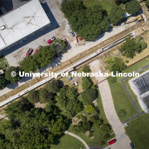 Facilities Planning and Construction will soon wrap up the overhaul of a nearly 500-foot steam tunnel that has resided on East Campus since the 1960s. The in-progress tunnel running between East Thermal Energy Storage (top left) and a set of greenhouses (bottom right). Steam tunnel replacement project on East Campus. The tunnel runs north from the intersection of 38th Street and the East Campus Loop. August 6, 2020. Photo by Craig Chandler / University Communication.