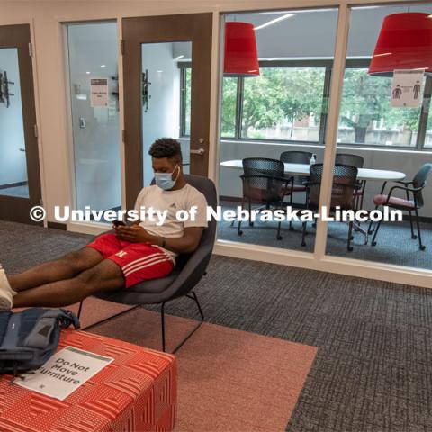 Tedum Npimnee, a junior international business major, waits for an appointment in the new Husker Hub office in Canfield Administration Building. Previously located in Pound Hall, Husker Hub recently moved into its remodeled space. August 12, 2020. Photo by Gregory Nathan / University Communication.