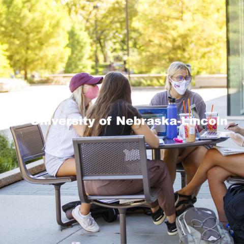 Alexis Carter talks with fellow Alpha Phi sorority members as they study outside of Adele Coryell Hall Learning Commons. First Day of classes on UNL campus. August 17, 2020. Photo by Craig Chandler / University Communication.