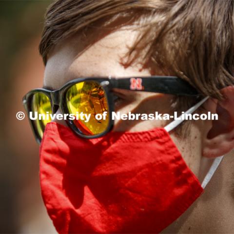 Brian Quimby from Minnesota listens to introductions from others at the CASNR Launch reflected in his sunglasses. CASNR Launch for new students included a walking tour of East Campus with multiple stops to learn about majors, programs and points of interest like the Dairy Store. August 20, 2020. Photo by Craig Chandler / University Communication.