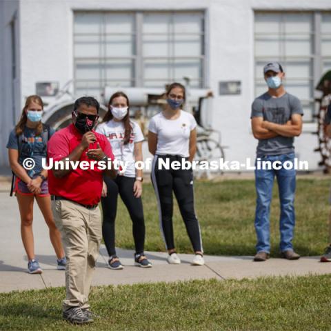 Santosh Pitla explains his robotic tractor research to students at the Launch. CASNR Launch for new students included a walking tour of East Campus with multiple stops to learn about majors, programs and points of interest like the Dairy Store. August 20, 2020. Photo by Craig Chandler / University Communication.