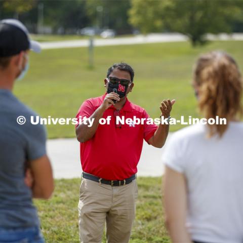 Santosh Pitla explains his robotic tractor research to students at the Launch. CASNR Launch for new students included a walking tour of East Campus with multiple stops to learn about majors, programs and points of interest like the Dairy Store. August 20, 2020. Photo by Craig Chandler / University Communication.