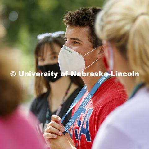 Dylan Beck of Lincoln, listens to CASNR Dean Tiffany Heng-Moss talk with students during the Launch. CASNR Launch for new students included a walking tour of East Campus with multiple stops to learn about majors, programs and points of interest like the Dairy Store. August 20, 2020. Photo by Craig Chandler / University Communication.