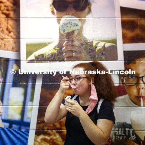 Caitlin Garcia of Papillion enjoys Dairy Store ice cream surrounded by other fans Thursday at the CASNR Launch. CASNR Launch for new students included a walking tour of East Campus with multiple stops to learn about majors, programs and points of interest like the Dairy Store. August 20, 2020. Photo by Craig Chandler / University Communication.