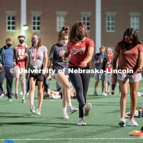 Students perform the Cupid Shuffle during the HuskerMania Masker Singer event at Mabel Lee Fields. August 21, 2020. Photo by Jordan Opp for University Communication.