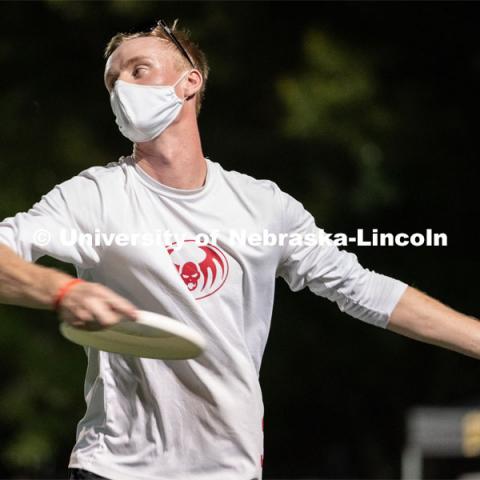 Senior Josh Adams throws a frisbee during the HuskerMania Masker Singer event at Mabel Lee Fields. August 21, 2020. Photo by Jordan Opp for University Communication.