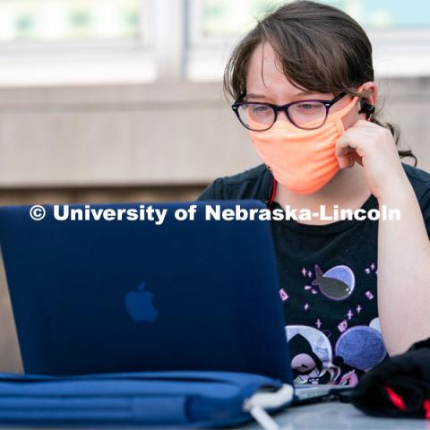 Freshman Journalism major Samantha Grove listens to a lecture through Zoom outside of Andersen Hall during the first day of in-person instruction at the University of Nebraska-Lincoln on Monday, August 24, 2020. Photo by Jordan Opp for University Communication.