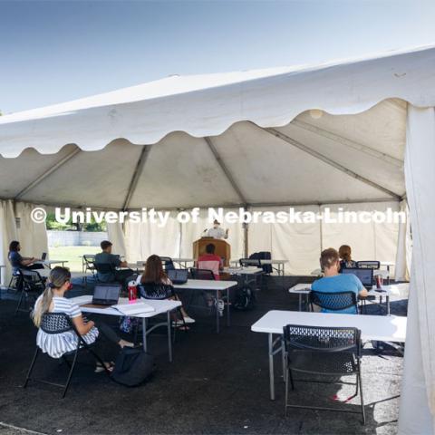 Law Professor Matt Schaefer teaches LAW 671 International Trade Law in a tent set up outdoors at the Law College. First day for in-person learning for the fall semester. August 24, 2020. Photo by Craig Chandler / University Communication.