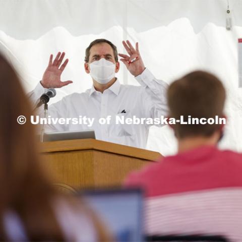 Law Professor Matt Schaefer teaches LAW 671 International Trade Law in a tent set up outdoors at the Law College. First day for in-person learning for the fall semester. August 24, 2020. Photo by Craig Chandler / University Communication.